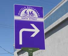 Purple sign reading "Bicycle Boulevard Ninth Street"