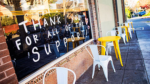 Message in cafe window: 'thank you for all of the support'