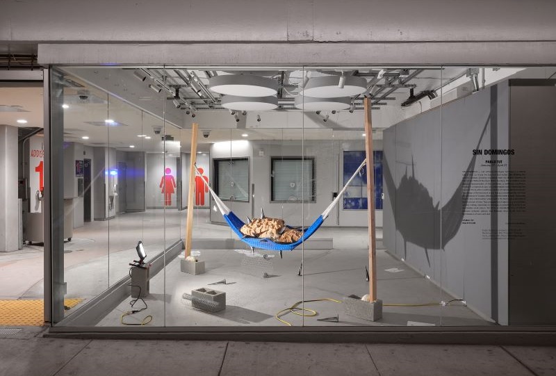 Installation of sculpture piece featuring a hammock