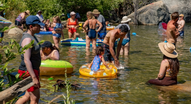 Tuolumne Camp families enjoying the swimming hole