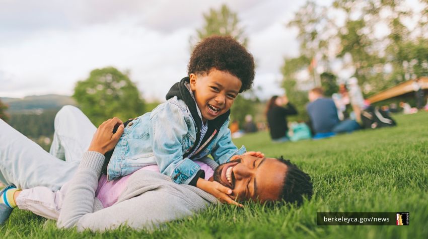 Father and son playing in a park