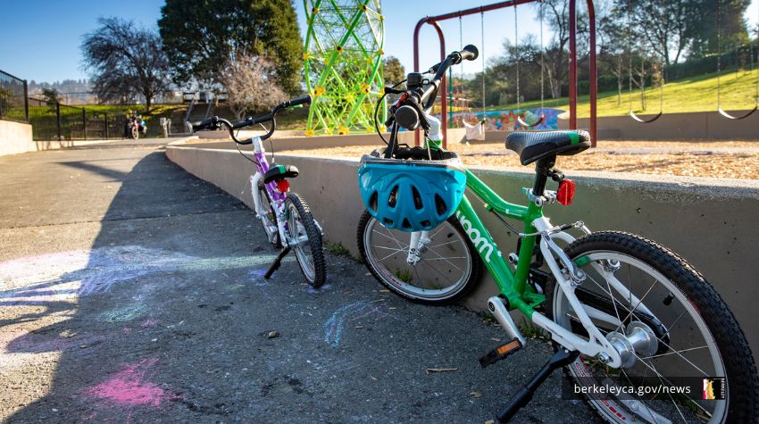Bicycles lined up by a wall in a City of Berkeley playground