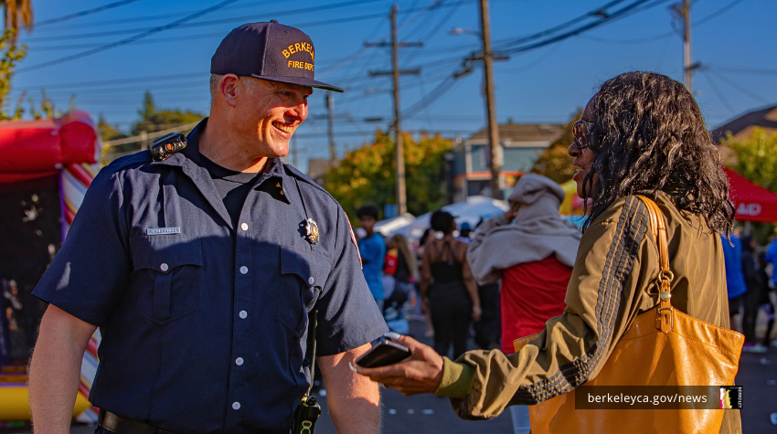 Firefighter talks with resident