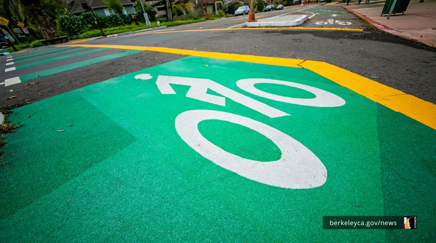 A low photo of a green-painted bike lane