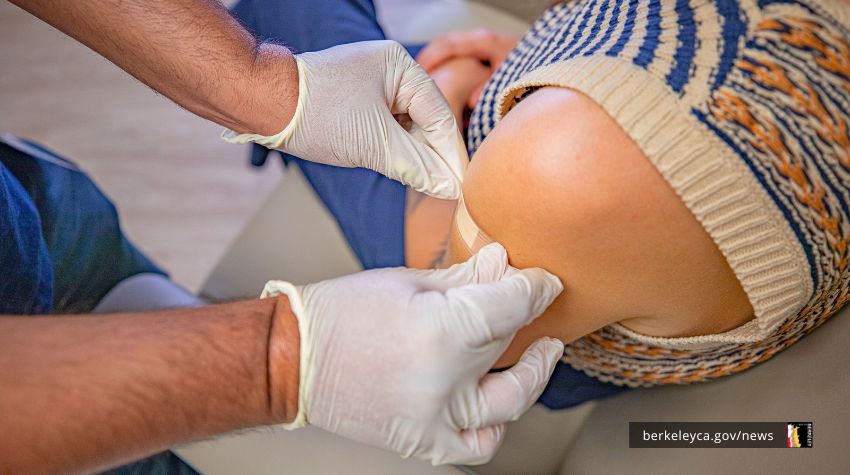 Person getting a bandaid after vaccination