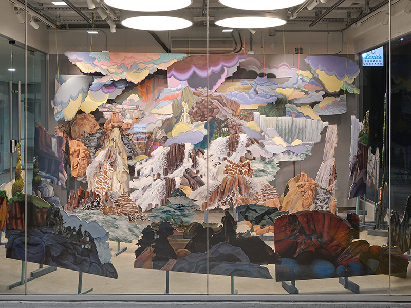 Stage-set panels of wood painted with colorful landscape scenery