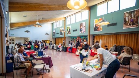 Large room filled with informational tables