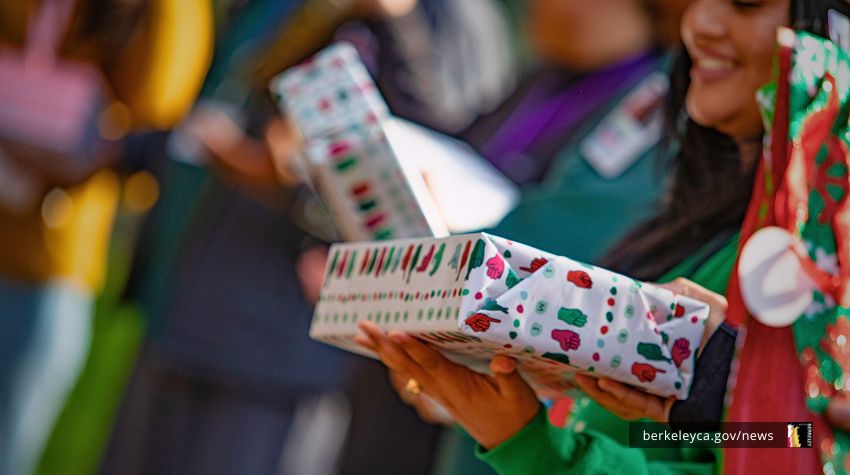 Close up of a person holding a wrapped present
