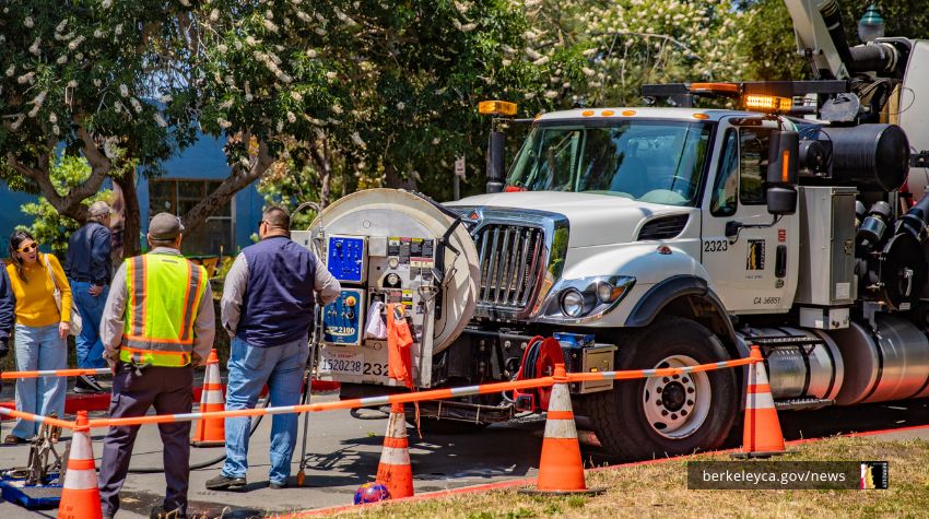 Public Works employees showcase a vactor truck at the 2025 Public Works Celebration Event