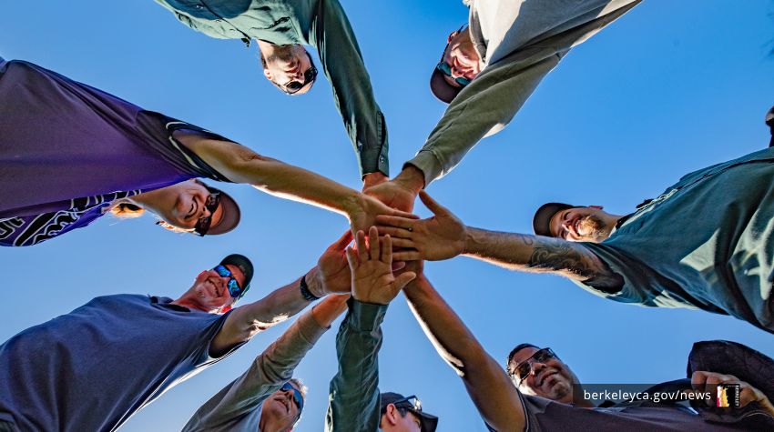 Group of people stack hands