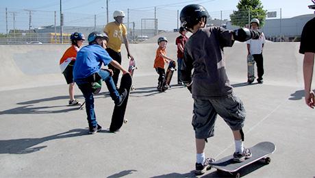 Kids having a skateboard lesson