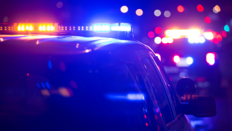 Police vehicles with lights on