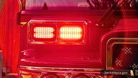 Red flashing emergency lights with red halo