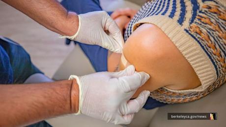 Person getting a bandaid after vaccination