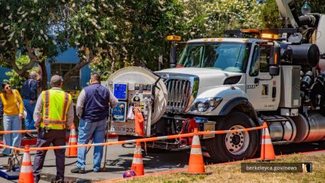 Public Works employees showcase a vactor truck at the 2025 Public Works Celebration Event