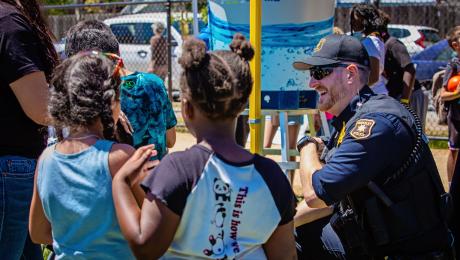 officer smiling with children