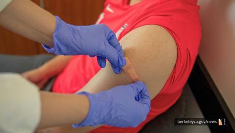 Person getting a bandaid after vaccination